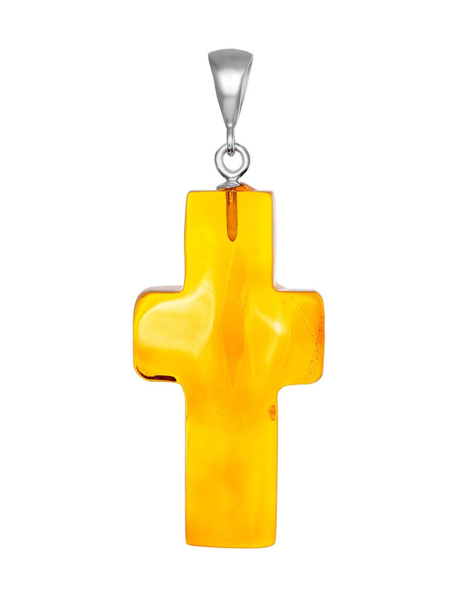 Cross pendant made of silver and natural amber of golden cognac color ...