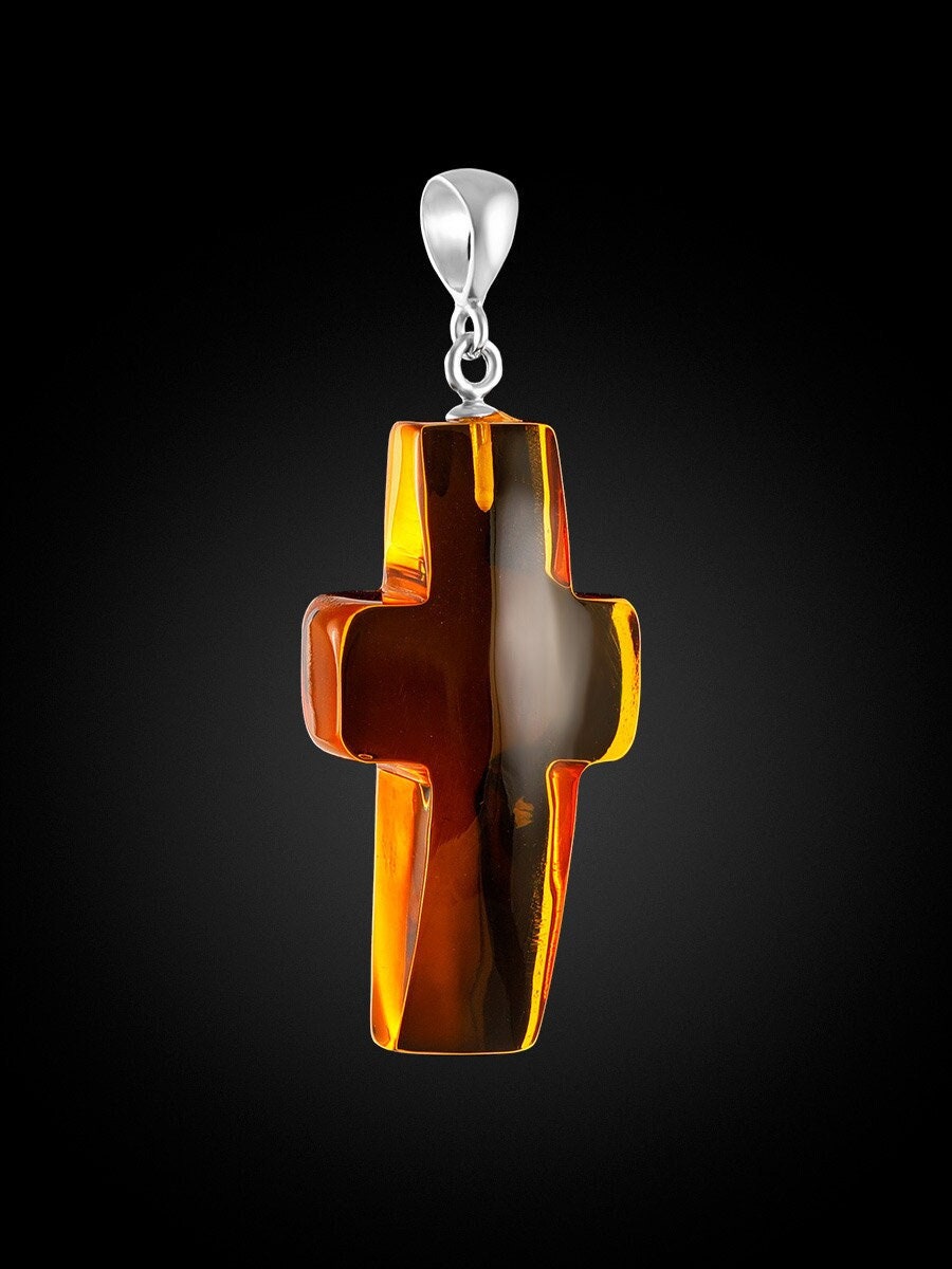 Cross pendant made of silver and natural amber of golden cognac color ...